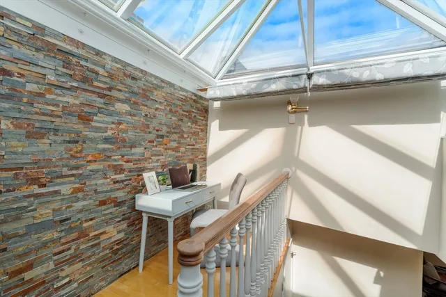 a view of entryway with wooden floor