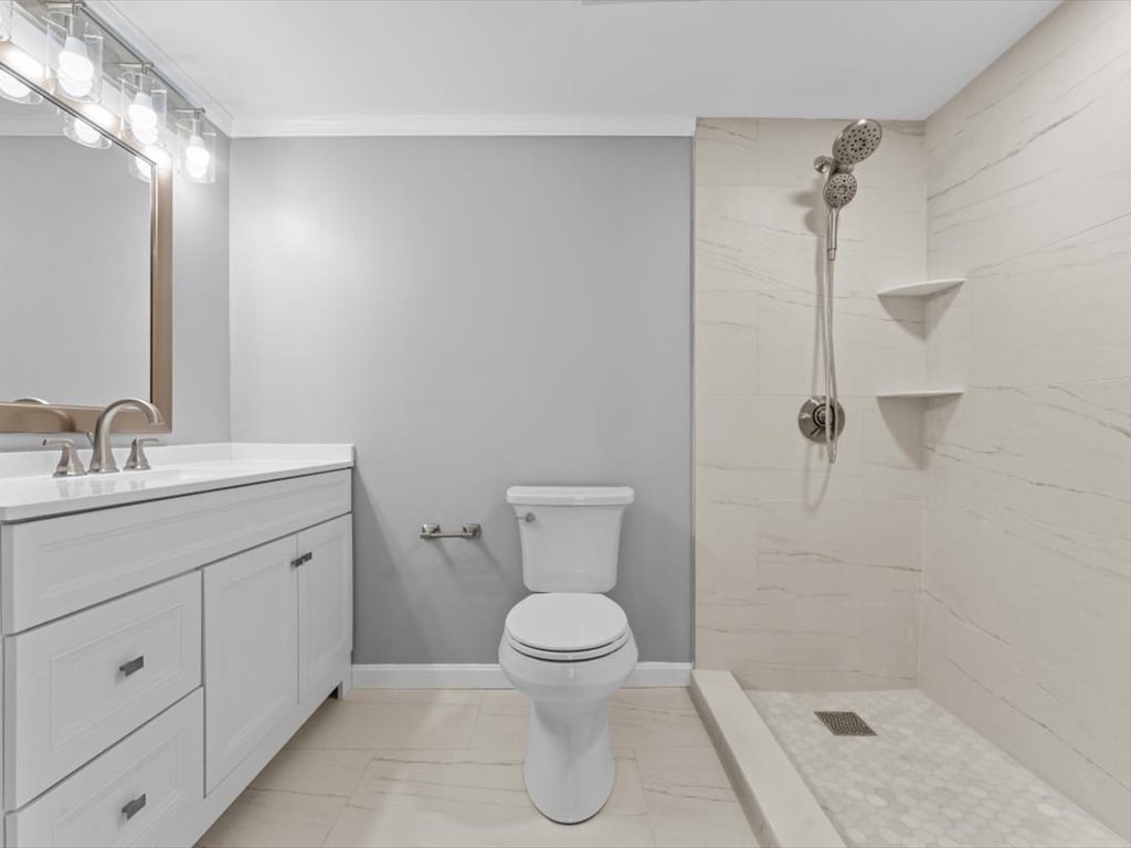 458 Beacon Street, Unit 6 Boston, MA 02115 - Photo 9 of 16 a bathroom with a sink a toilet and shower