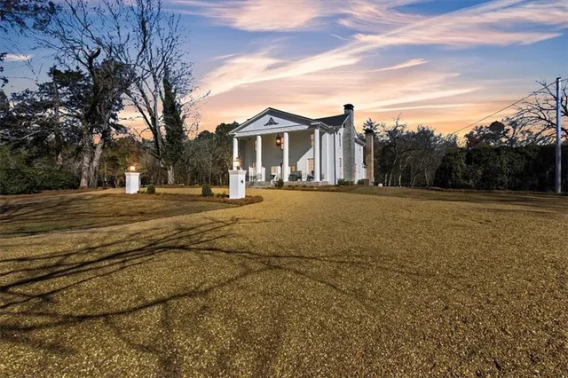 a swimming pool with outdoor seating and yard
