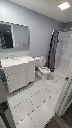 a bathroom with a double vanity sink and mirror