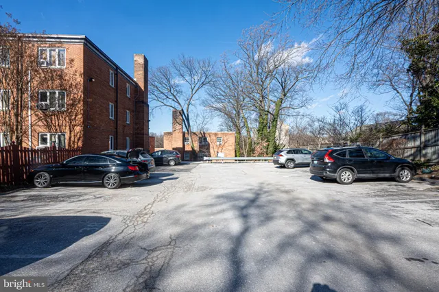 a view of street with parked cars
