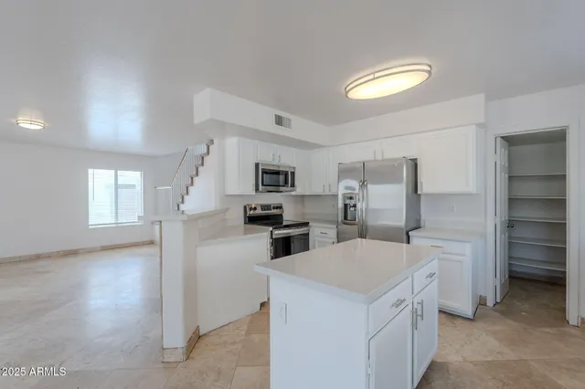 a kitchen with a stove and a sink