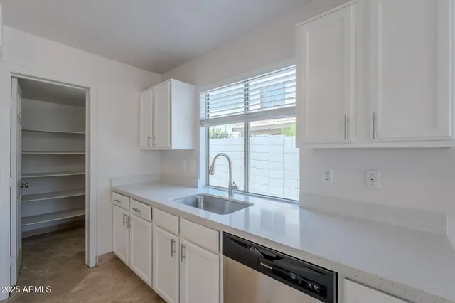a bathroom with a toilet a sink and a mirror