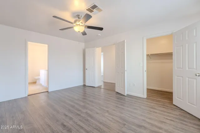 a bathroom with a bathtub and a window