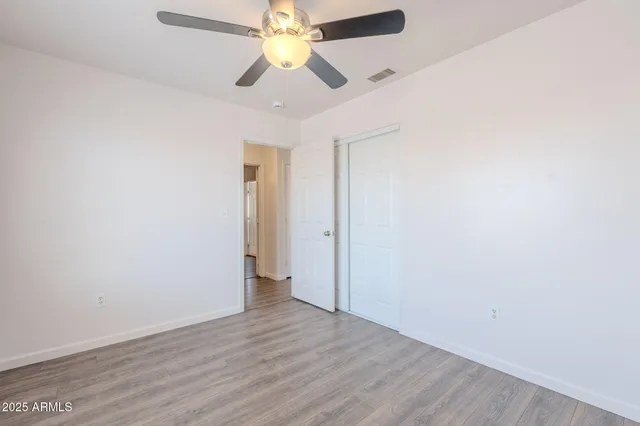 a bathroom with a toilet and shower