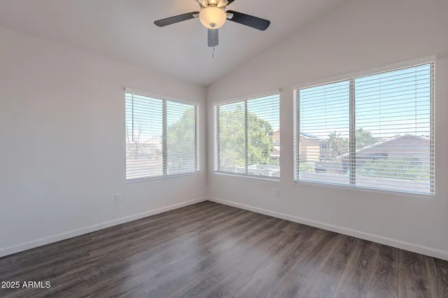 a view of balcony with wooden floor and fence