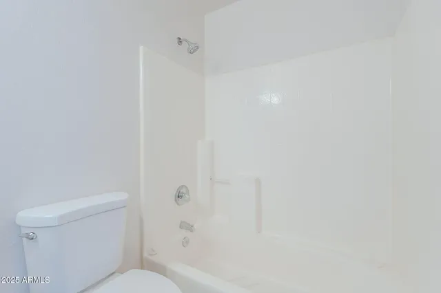 a view of a house with a yard and garage