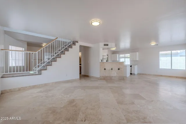 a view of empty room with a fireplace