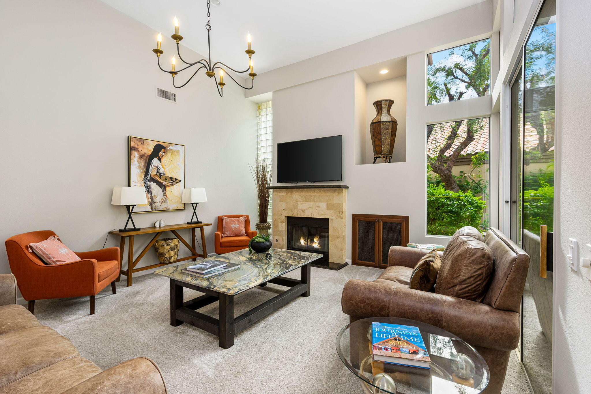 55685 Riviera La Quinta, CA 92253 - Photo 11 of 75 a living room with furniture a fireplace and a flat screen tv