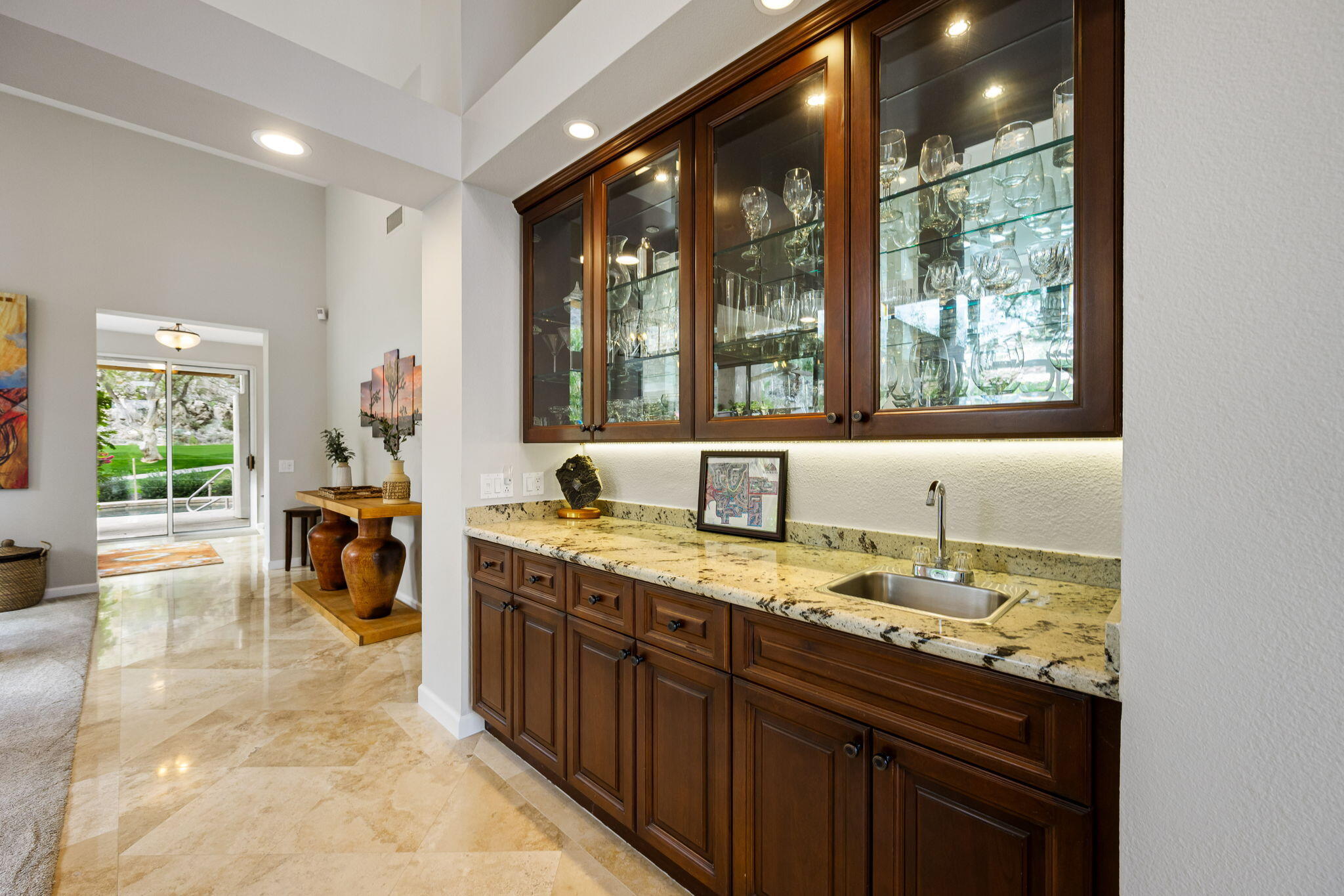 55685 Riviera La Quinta, CA 92253 - Photo 16 of 75 a view of a kitchen with a sink and dishwasher next to a window