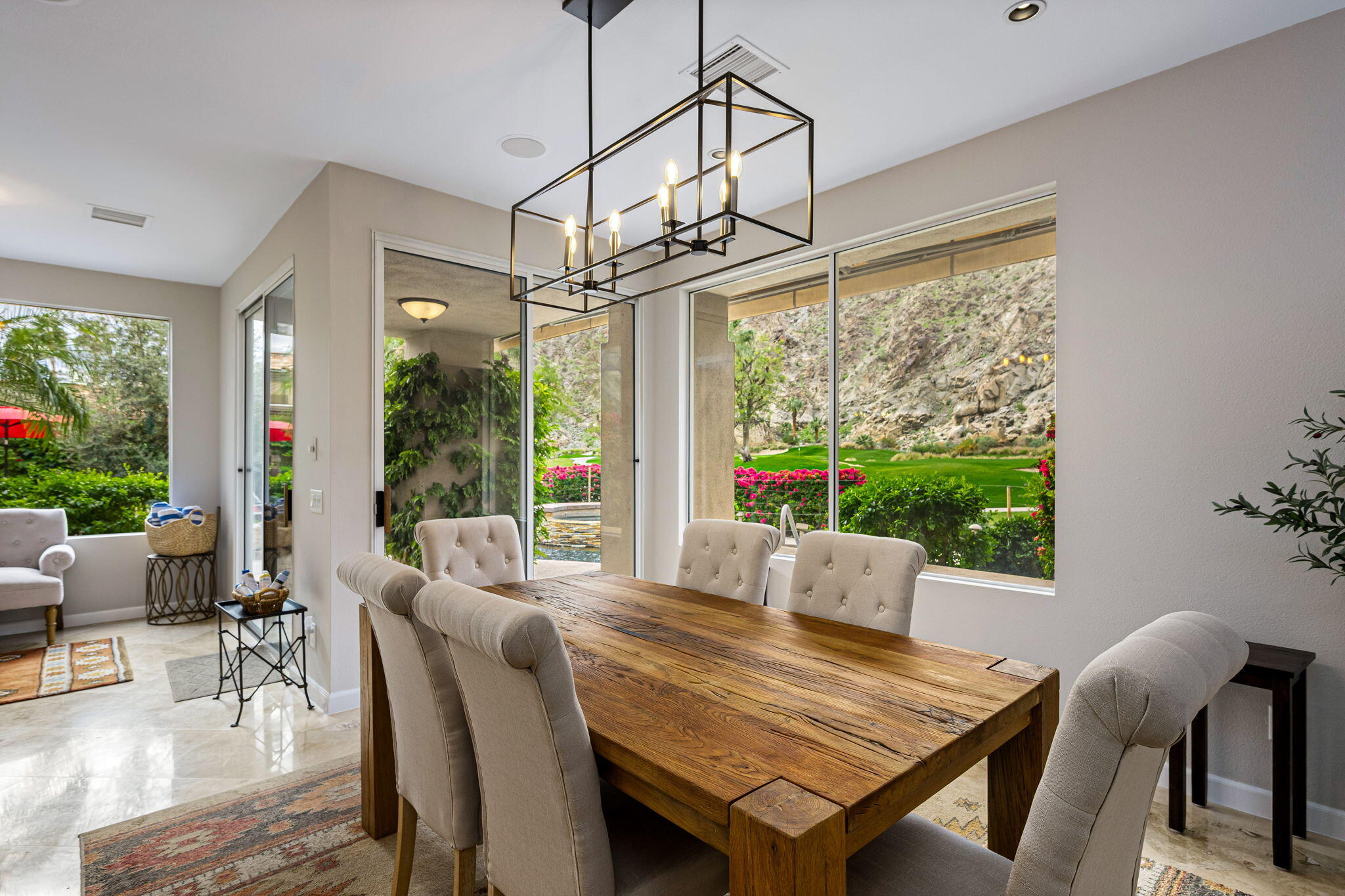55685 Riviera La Quinta, CA 92253 - Photo 23 of 75 a view of a dining room with furniture window and outside view