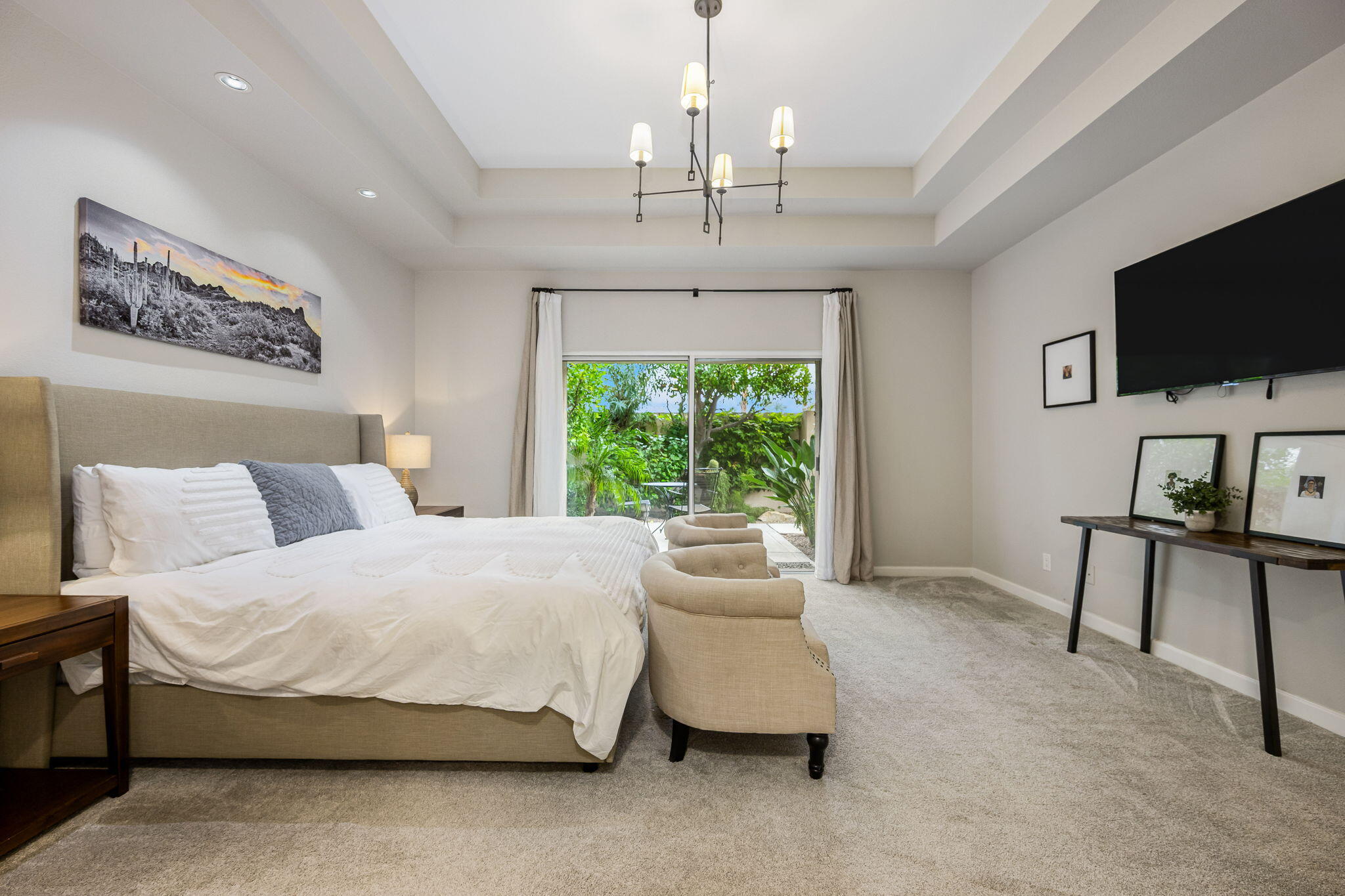 55685 Riviera La Quinta, CA 92253 - Photo 27 of 75 a spacious bedroom with a bed and a flat screen tv