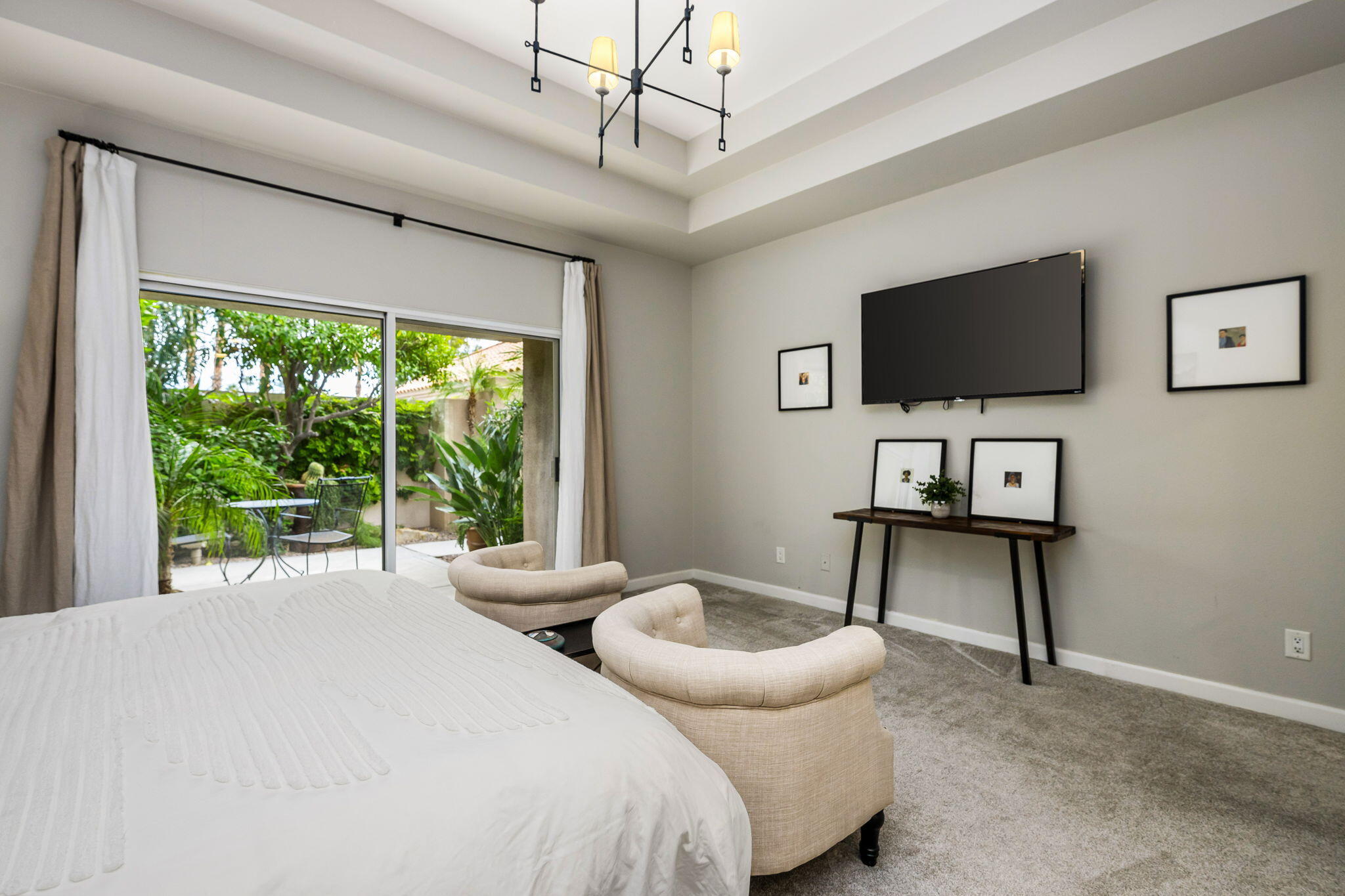 55685 Riviera La Quinta, CA 92253 - Photo 29 of 75 a spacious bedroom with a bed and a flat screen tv