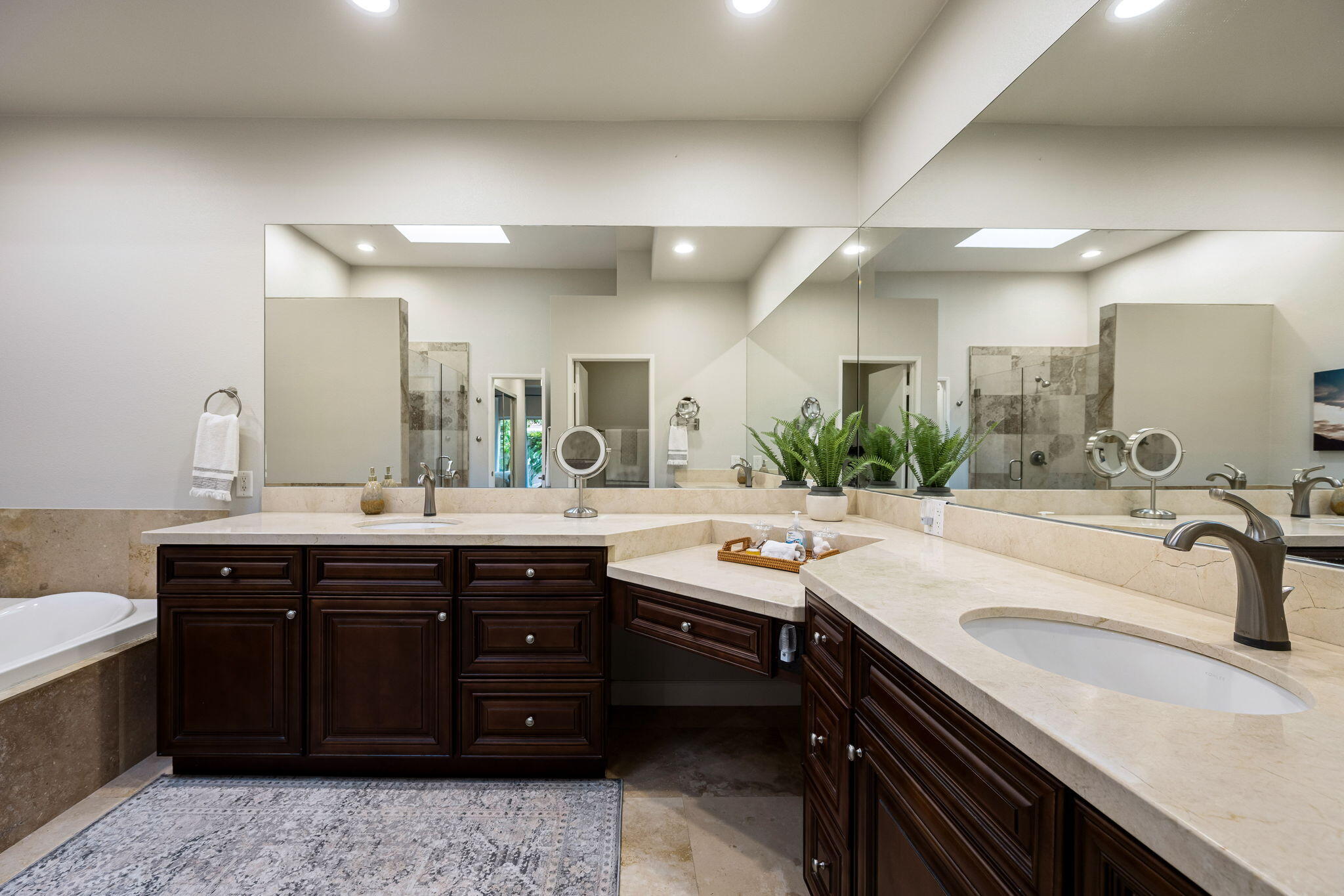 55685 Riviera La Quinta, CA 92253 - Photo 32 of 75 a bathroom with a granite countertop sink a toilet and a mirror