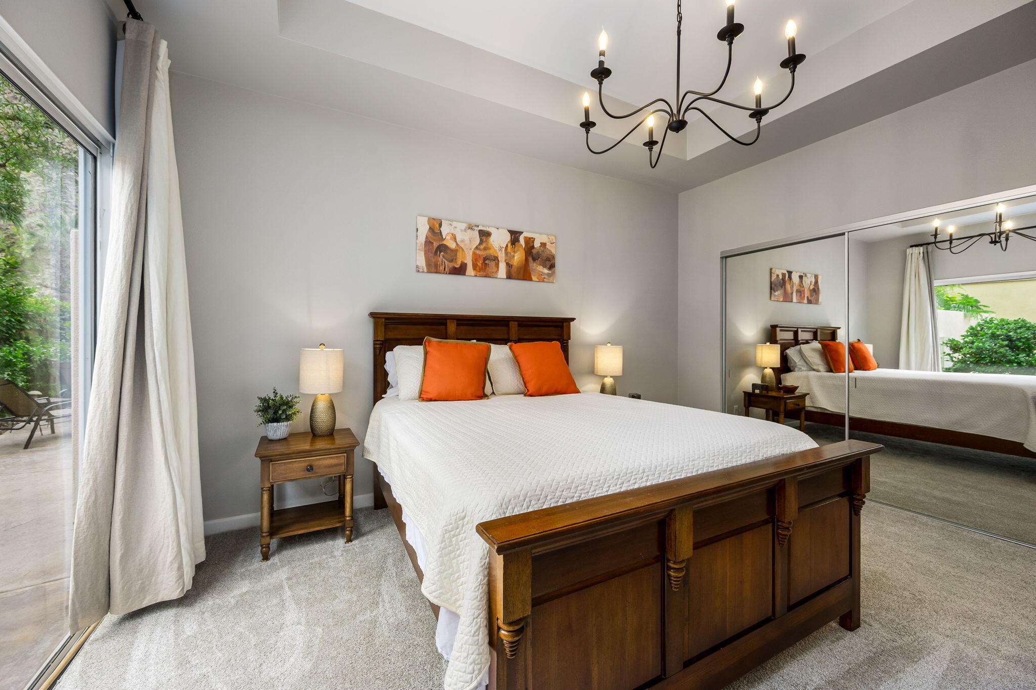 55685 Riviera La Quinta, CA 92253 - Photo 35 of 75 a bedroom with a bed and a chandelier