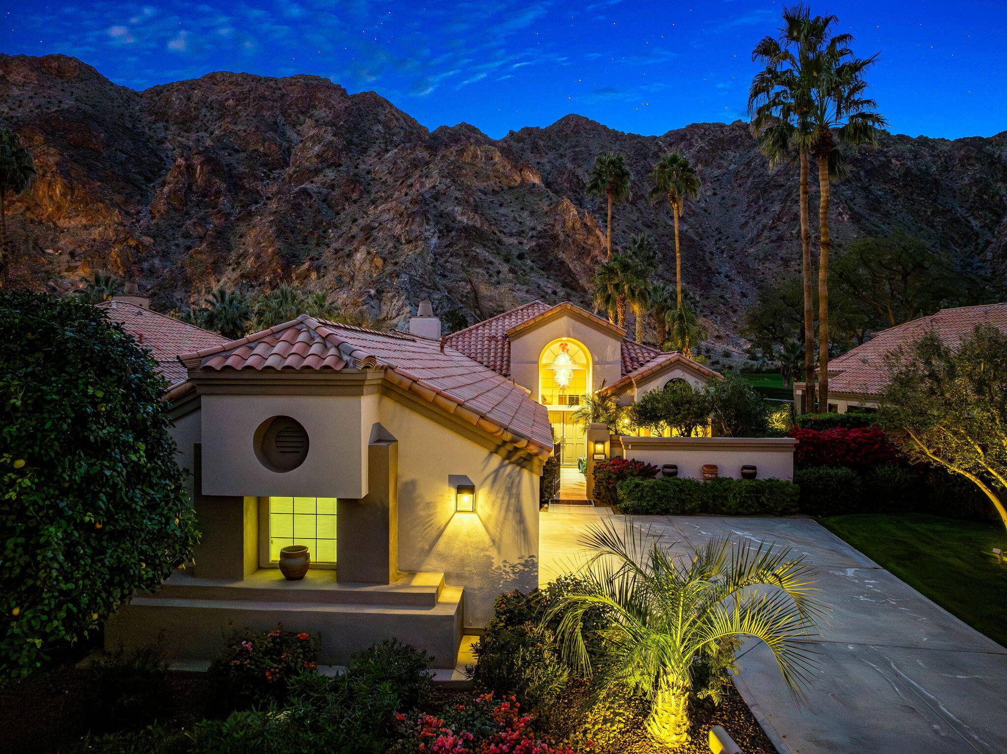 55685 Riviera La Quinta, CA 92253 - Photo 51 of 75 a view of a house with a yard and a garden