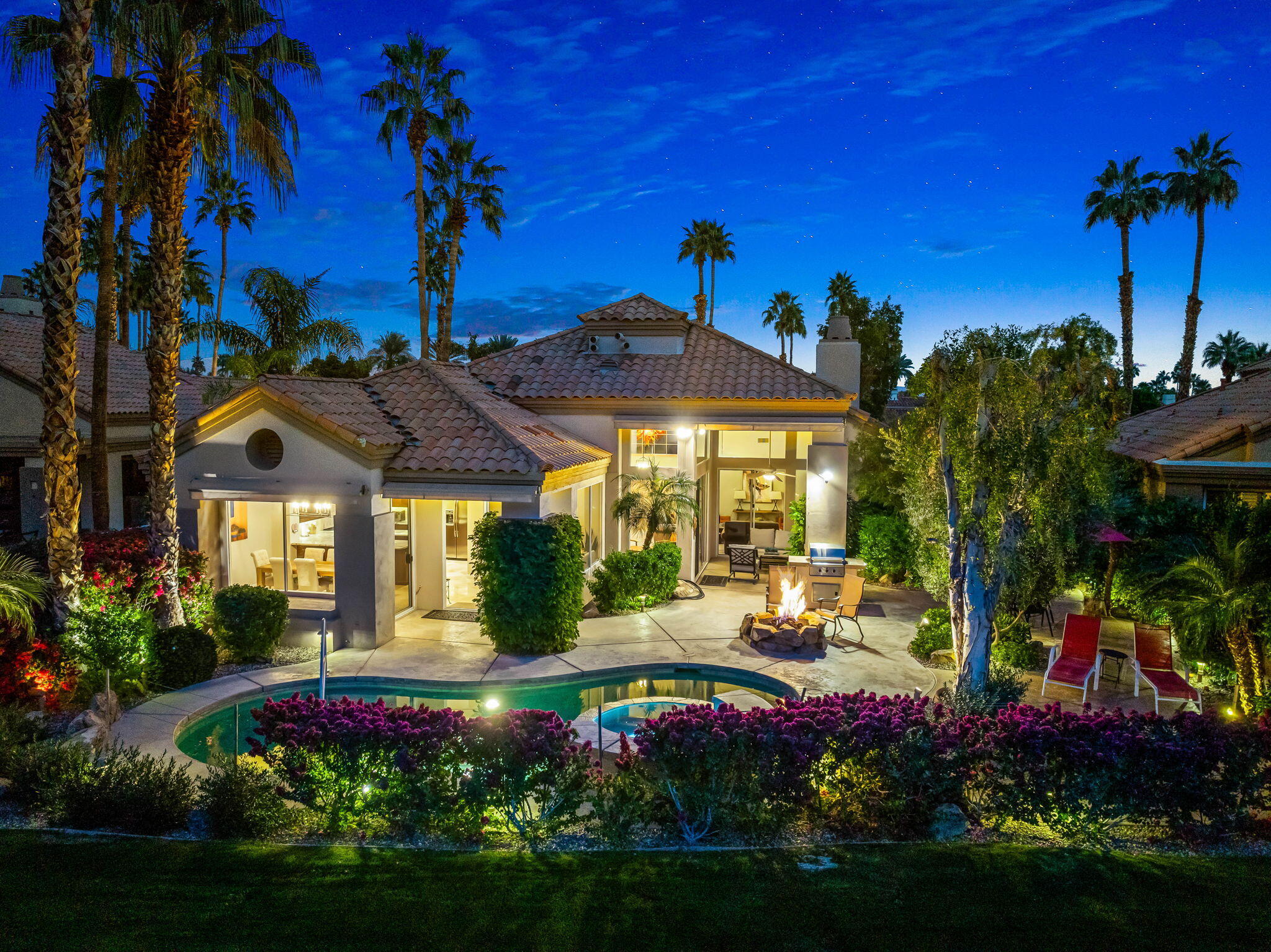 55685 Riviera La Quinta, CA 92253 - Photo 52 of 75 a view of a house with a yard and potted plants
