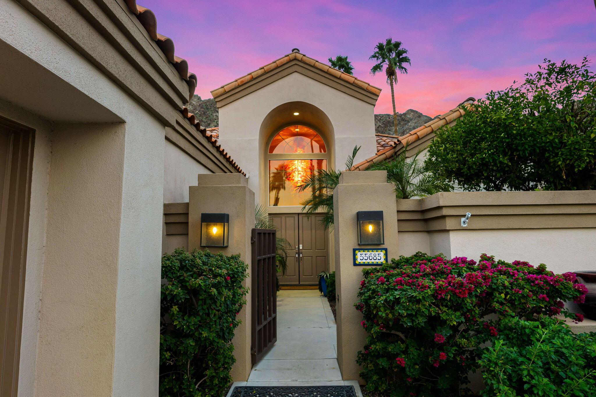 55685 Riviera La Quinta, CA 92253 - Photo 6 of 75 a front view of a house with a yard