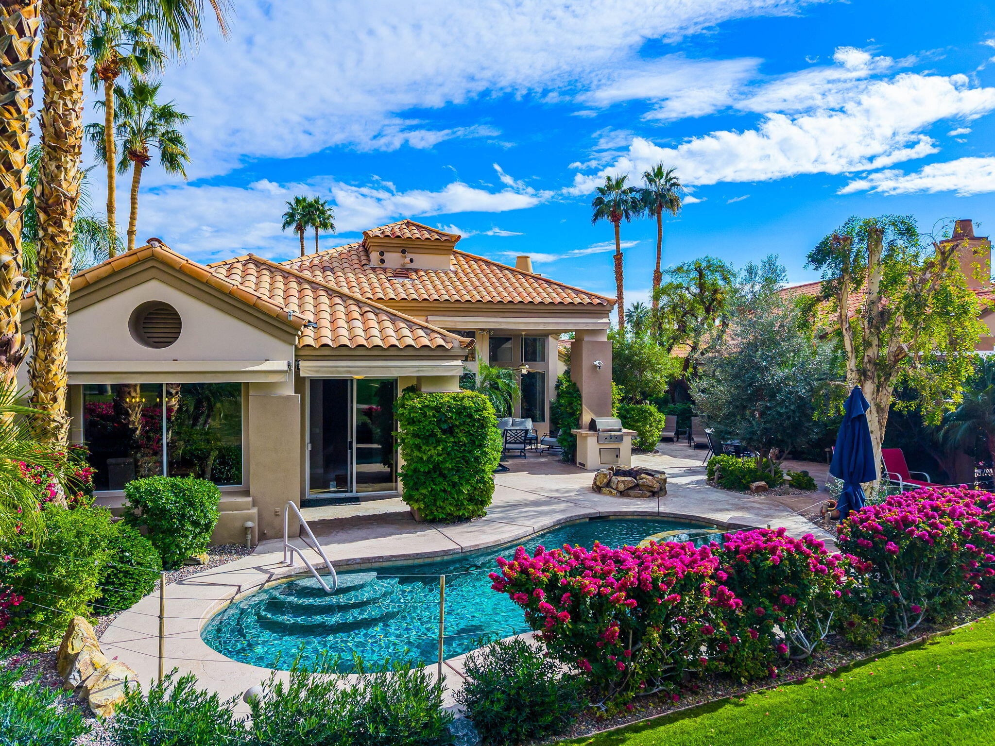 55685 Riviera La Quinta, CA 92253 - Photo 68 of 75 a view of a house with swimming pool garden and patio