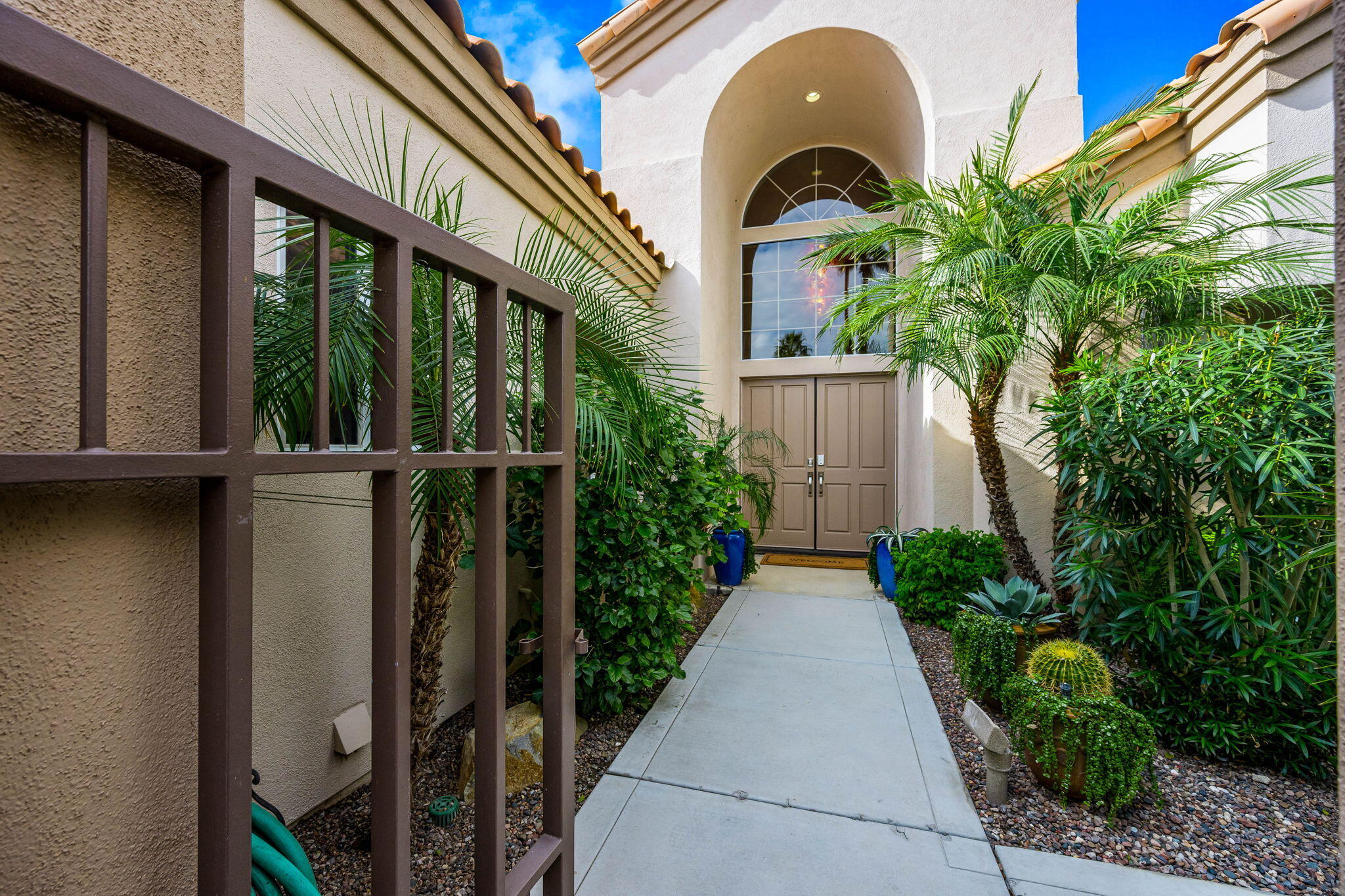 55685 Riviera La Quinta, CA 92253 - Photo 7 of 75 a view of a entrance gate of the house