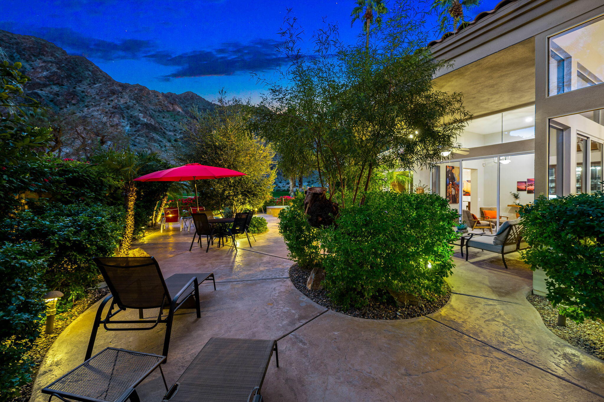 55685 Riviera La Quinta, CA 92253 - Photo 74 of 75 a view of a patio with a table and chairs under an umbrella