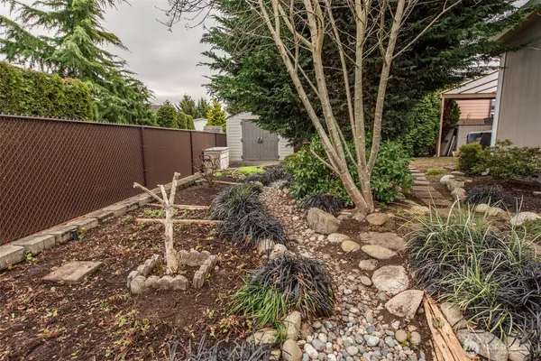 a backyard of a house with lots of green space