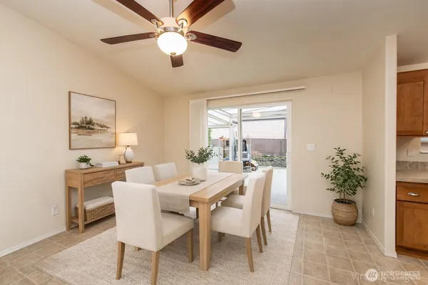 a dining room with furniture and window