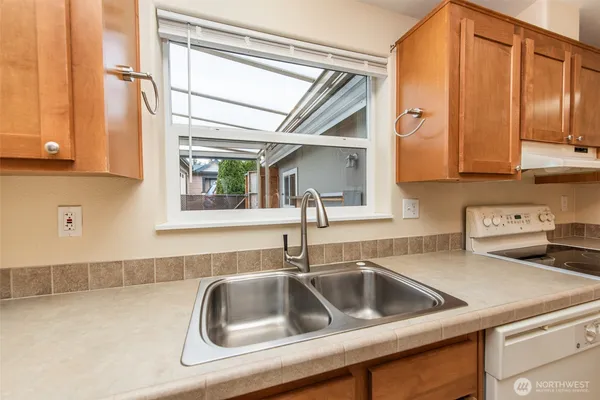 a kitchen with a sink and a window