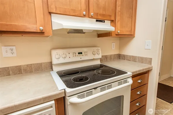 a kitchen with a stove and a microwave