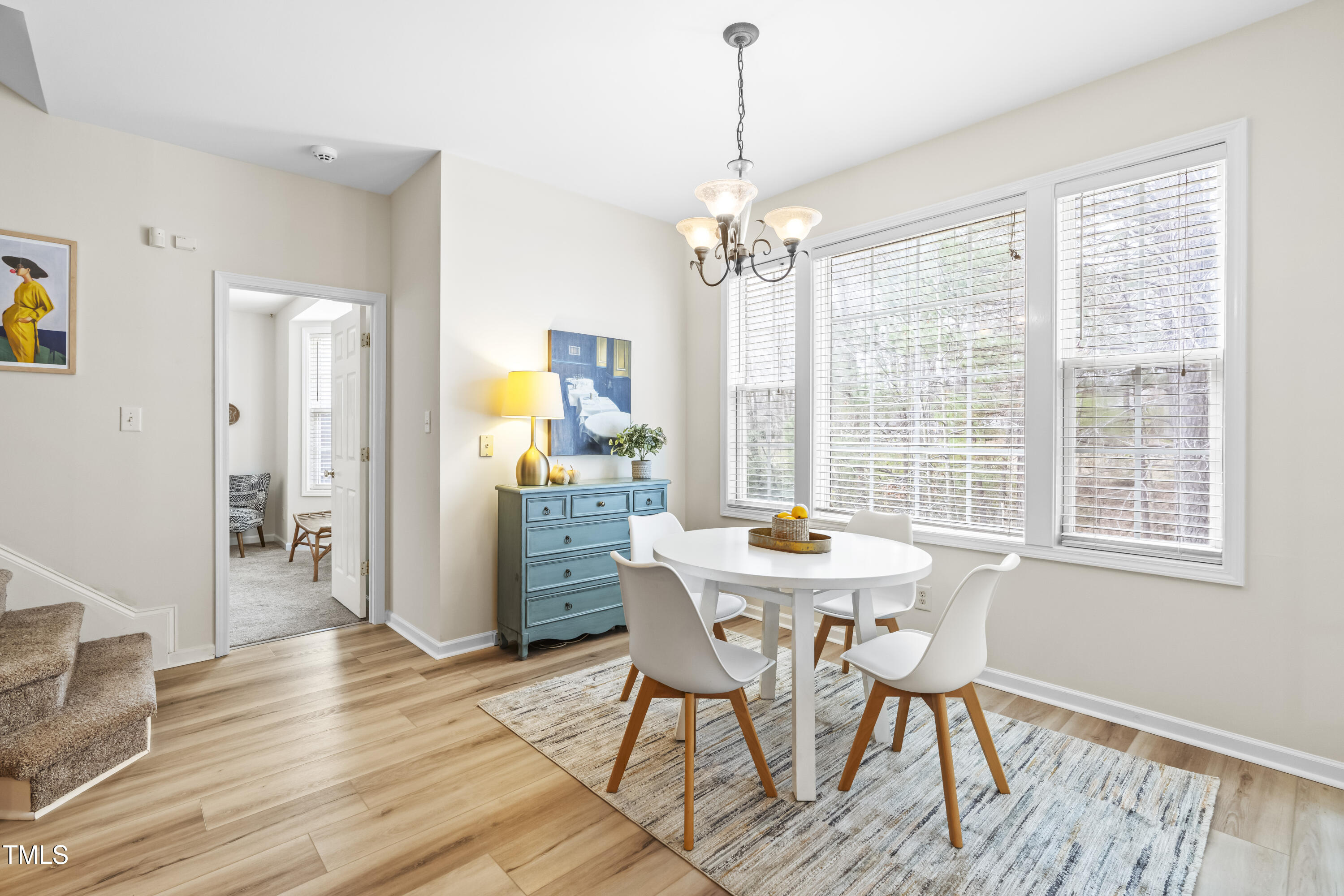 2008 Carnation Drive Durham, NC 27703 - Photo 14 of 39 a view of a dining room with furniture wooden floor and chandelier