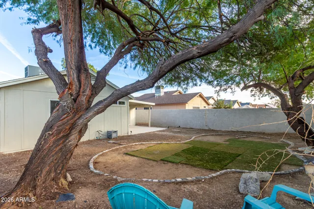 a view of a patio with table and chairs and potted plants