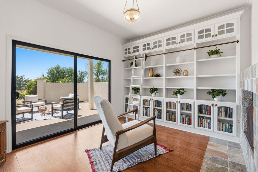 13319 Pacer Lane Poway, CA 92064 - Photo 36 of 75 a living room with furniture and a floor to ceiling window
