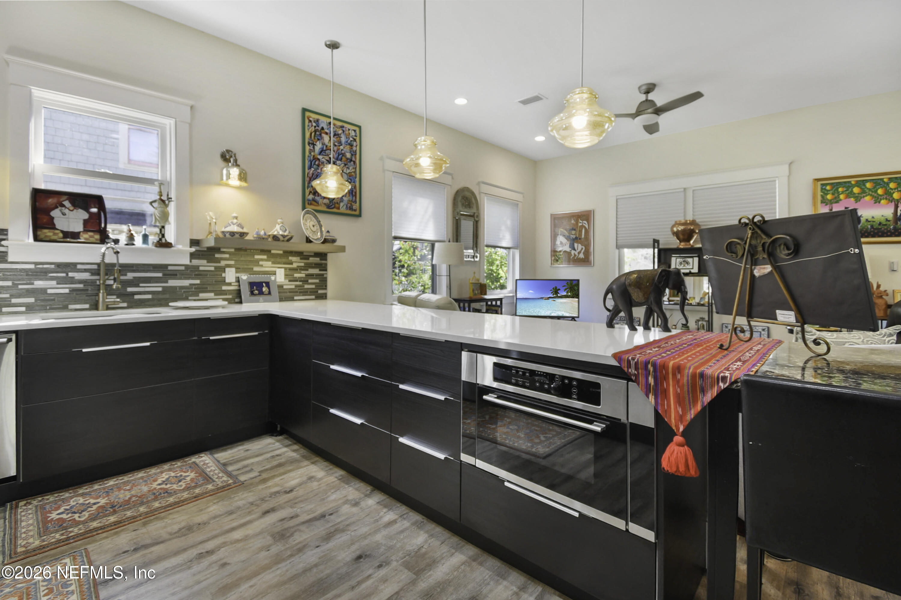 307 St George Street St. Augustine, FL 32084 - Photo 13 of 44 a kitchen with stainless steel appliances granite countertop a sink dishwasher stove and oven