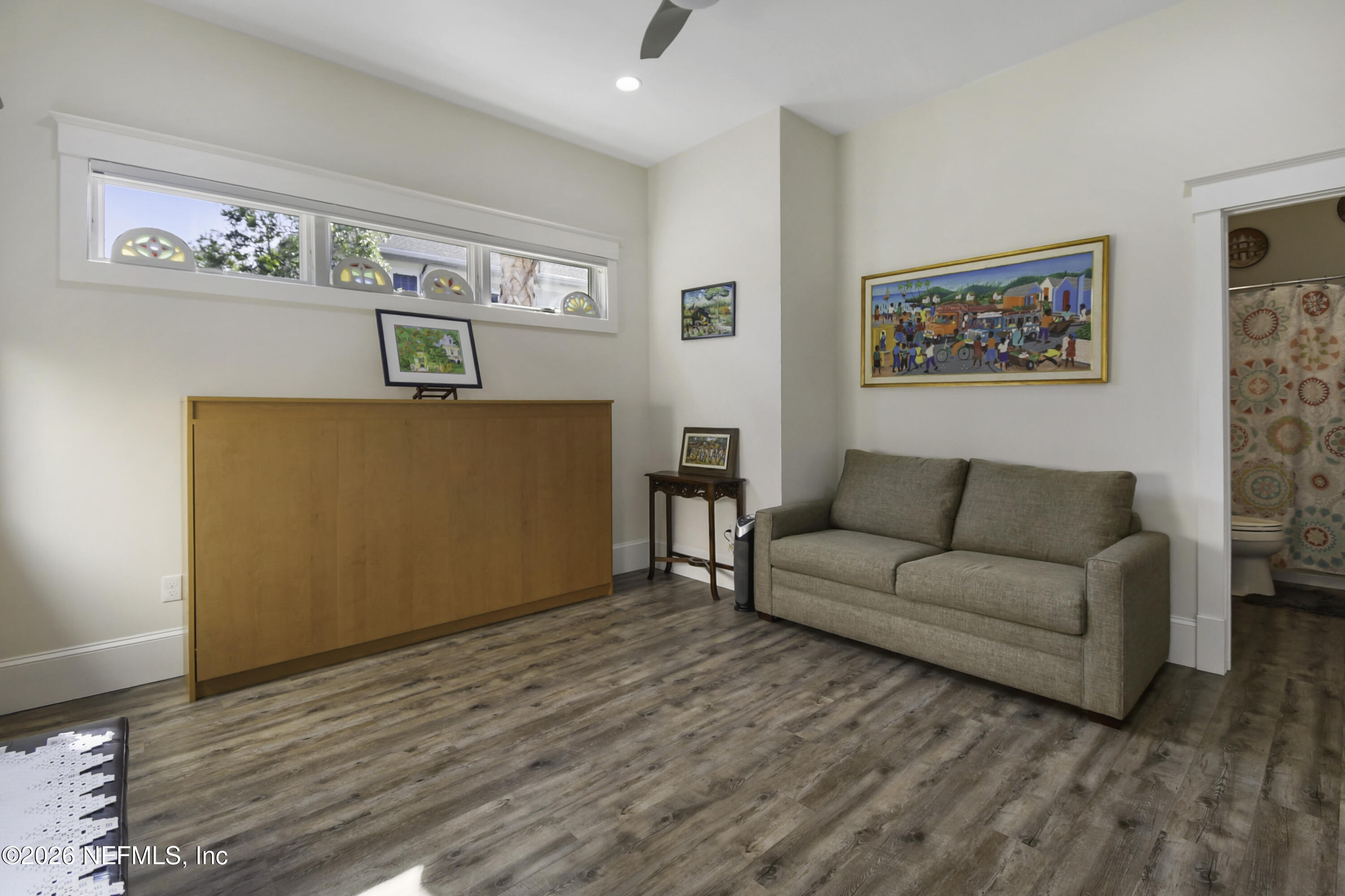 307 St George Street St. Augustine, FL 32084 - Photo 25 of 44 a living room with furniture and a wooden floor