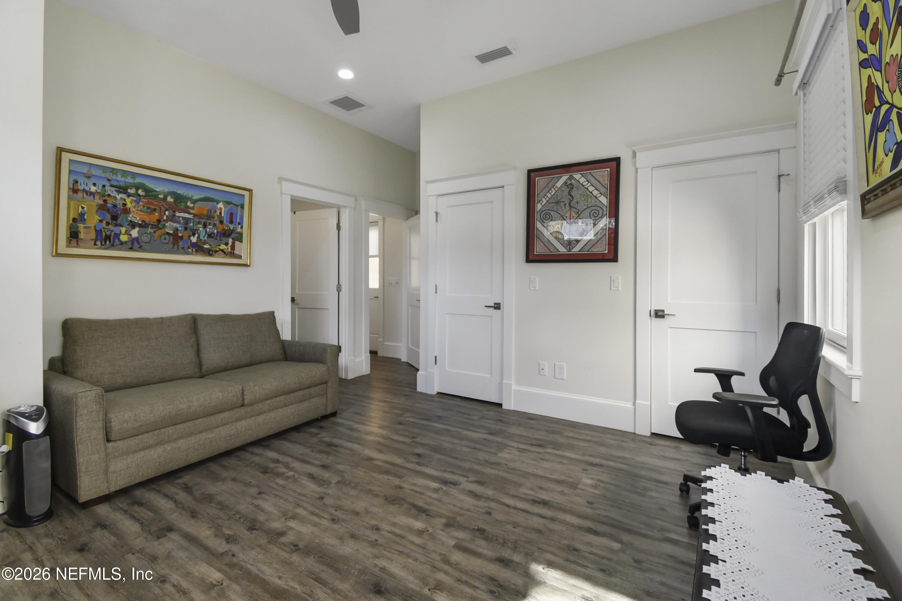 307 St George Street St. Augustine, FL 32084 - Photo 26 of 44 a living room with furniture and a flat screen tv