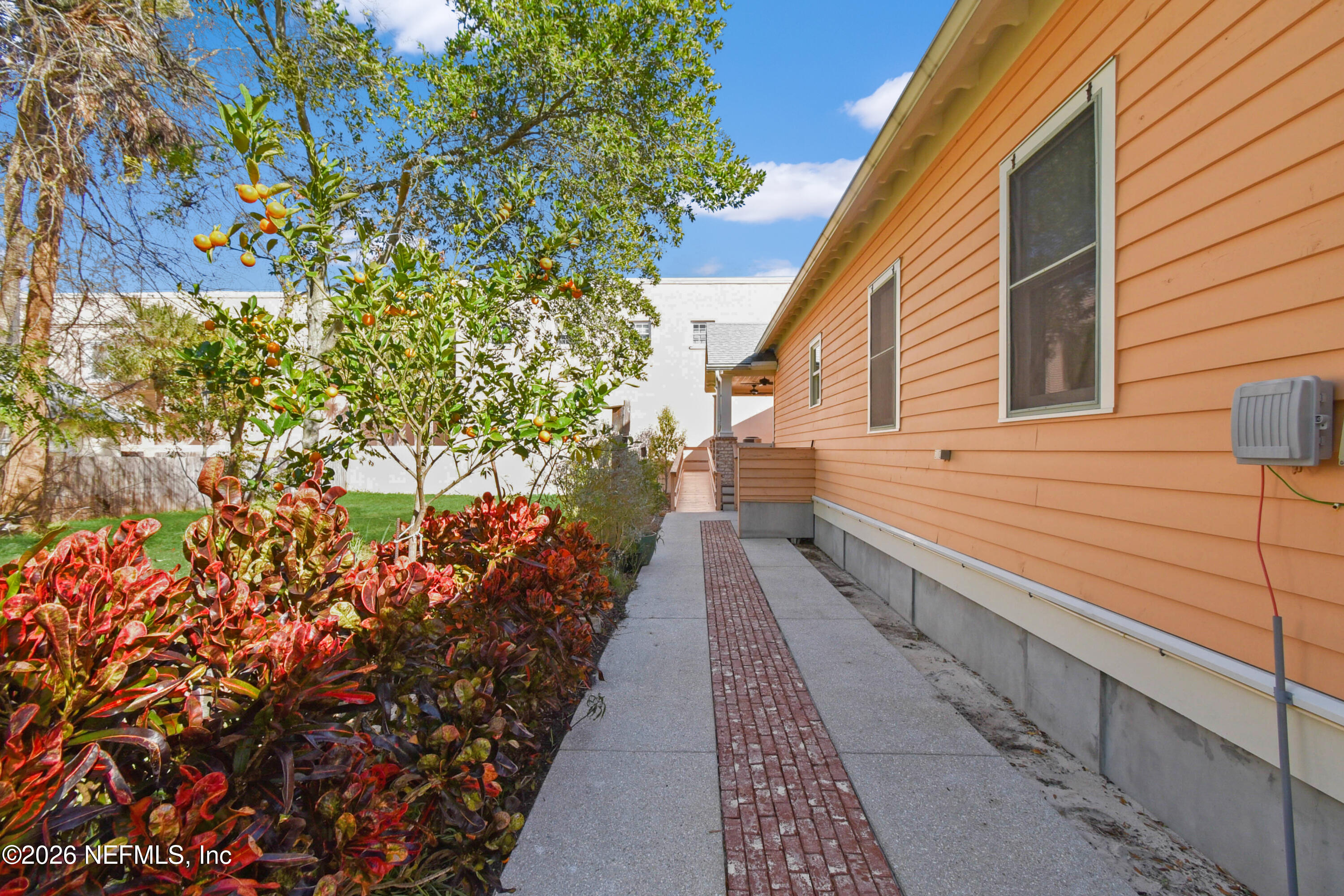 307 St George Street St. Augustine, FL 32084 - Photo 28 of 44 a view of a pathway with a flower garden
