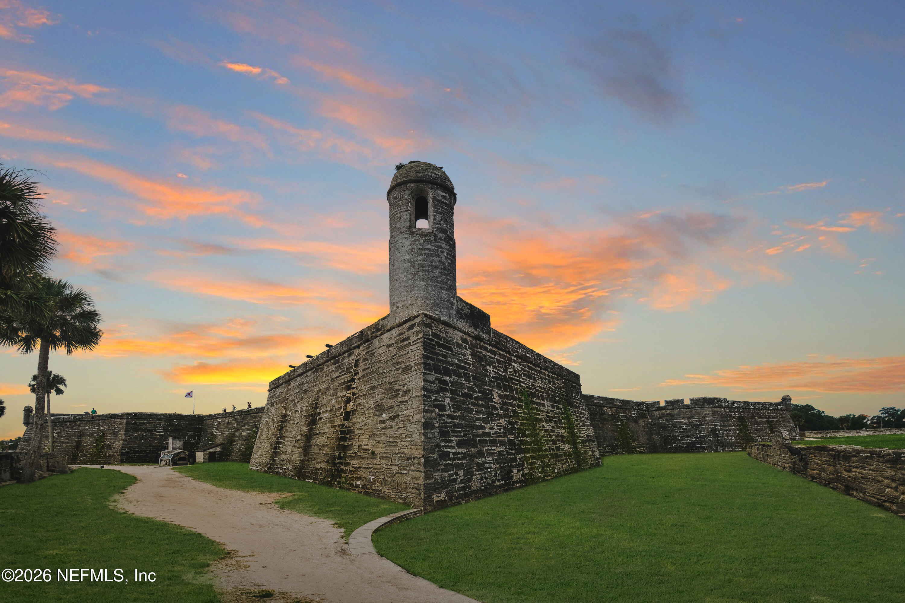 307 St George Street St. Augustine, FL 32084 - Photo 35 of 44 a view of a tall building next to a yard