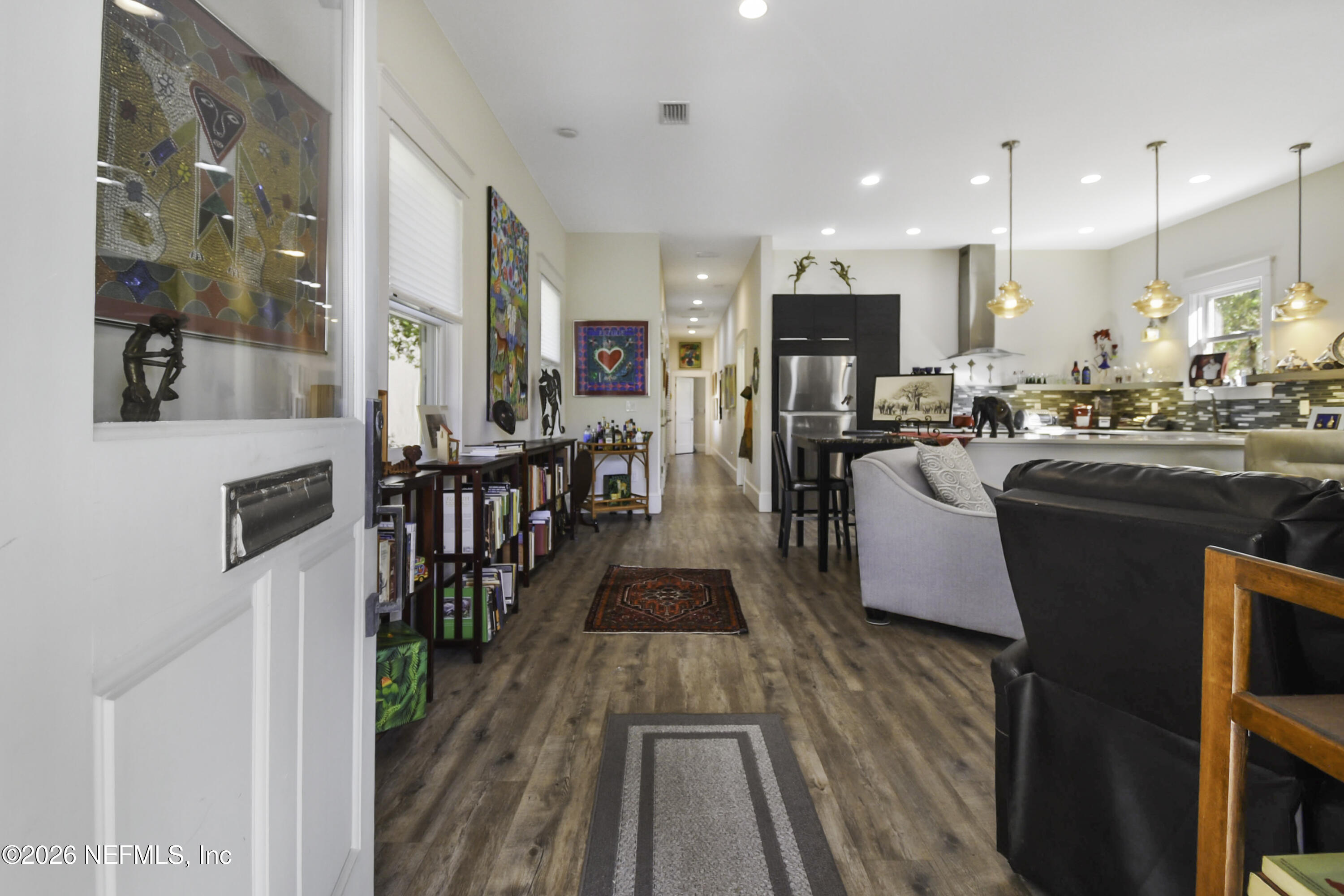 307 St George Street St. Augustine, FL 32084 - Photo 6 of 44 a view of a kitchen with kitchen island stainless steel appliances refrigerator stove microwave and cabinets
