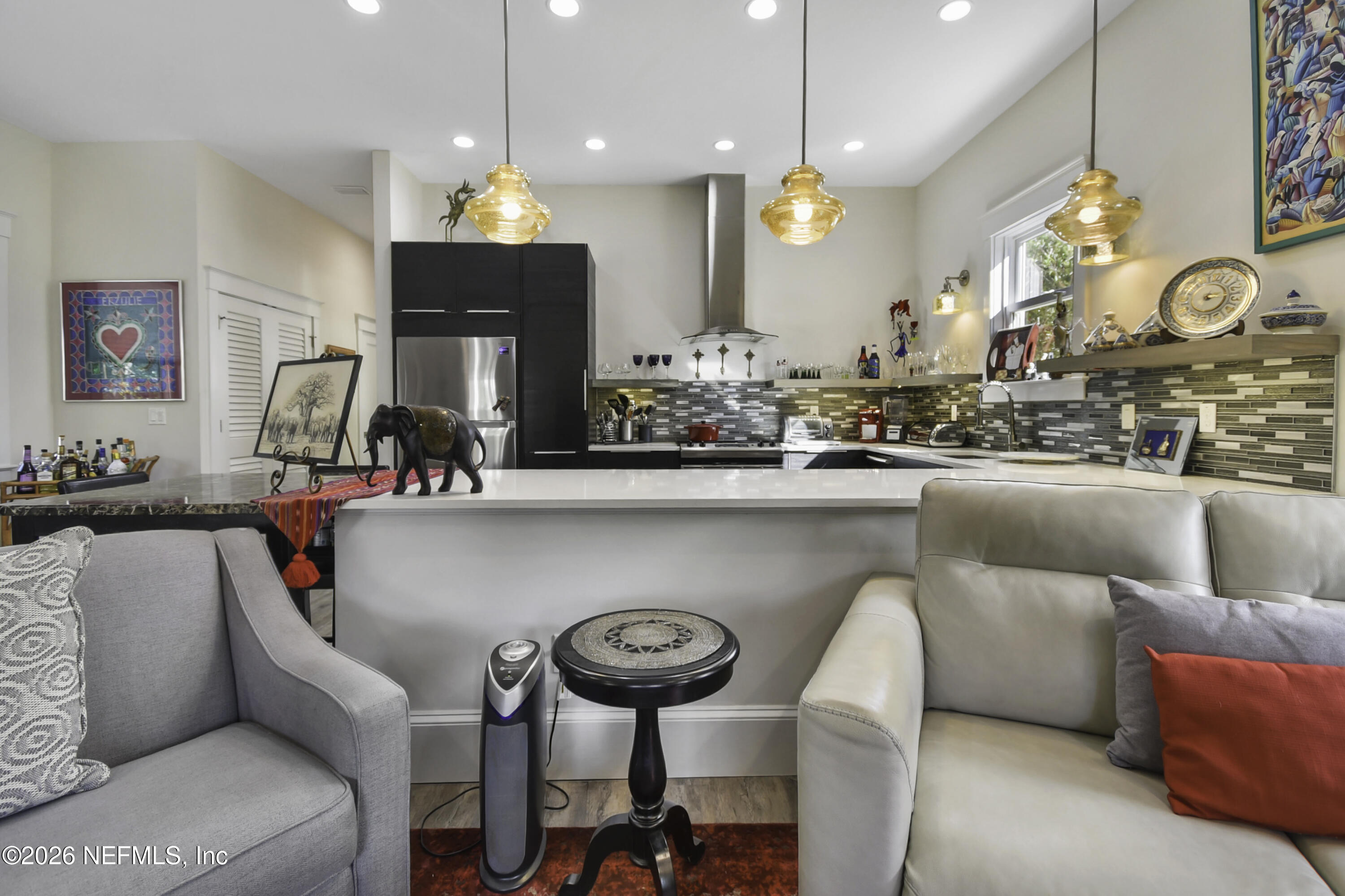 307 St George Street St. Augustine, FL 32084 - Photo 10 of 44 a living room with furniture and a chandelier