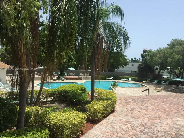 a view of a park with swings and slides