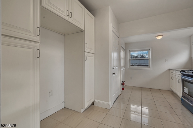 983 Colonial Avenue Union, NJ 07083 - Photo 12 of 28 a view of a kitchen with white cabinets