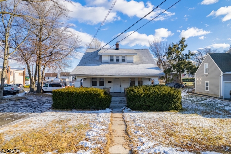 983 Colonial Avenue Union, NJ 07083 - Photo 26 of 28 a front view of a house with a garden