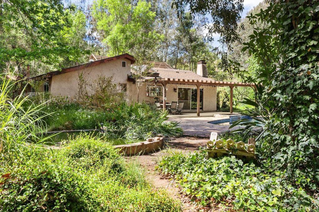 29560 Lilac Road Valley Center, CA 92082 - Photo 33 of 43 a house with lots of trees in the background