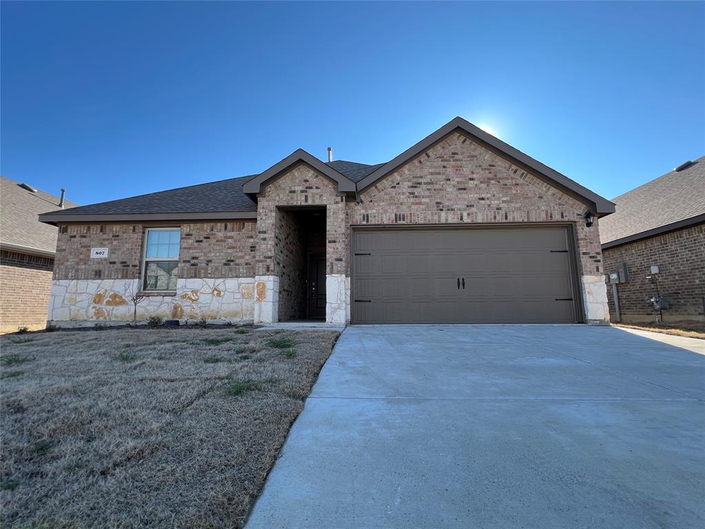 807 Cinnabar Way Princeton, TX 75407 - Photo 1 of 22 a view of garage and yard