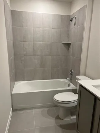 a bathroom with a toilet a sink and bathtub