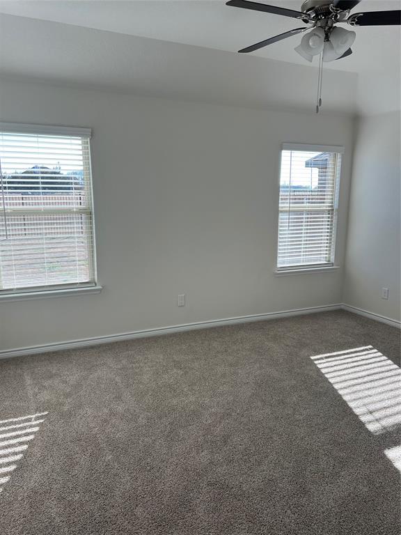 807 Cinnabar Way Princeton, TX 75407 - Photo 15 of 22 a view of an empty room with a window