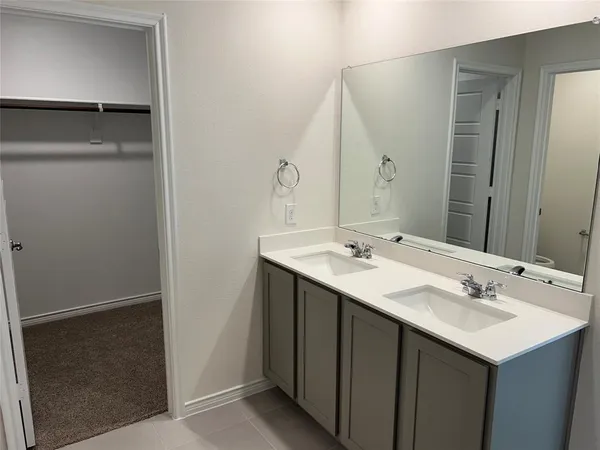 a bathroom with a sink and mirror