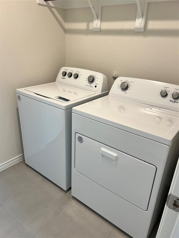 807 Cinnabar Way Princeton, TX 75407 - Photo 22 of 22 a utility room with dryer and washer