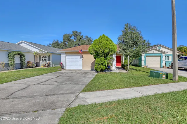 front view of a house with a yard