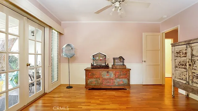 a view of a room with wooden floor and staircase